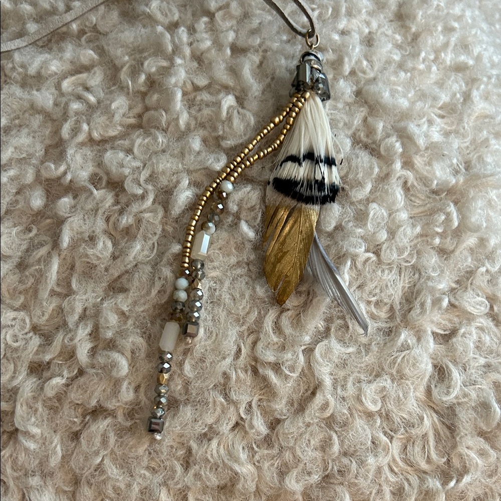 NEW LISTING AND NEW WITH TAGS! Leather beaded necklace with beautiful feathers!